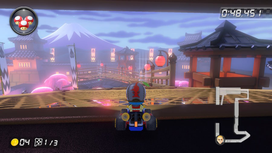 Kart na parte interna de um dojo, com visão para parte da estrutura mais à frente; ao fundo, imagem em baixa resolução do monte Fuji.
