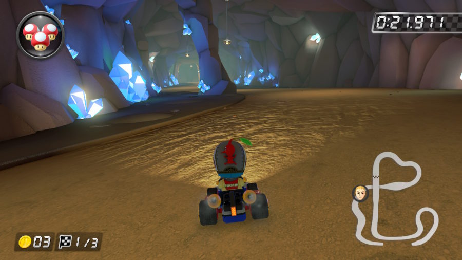 Kart em uma caverna, faróis acesos iluminando os cristais das paredes.