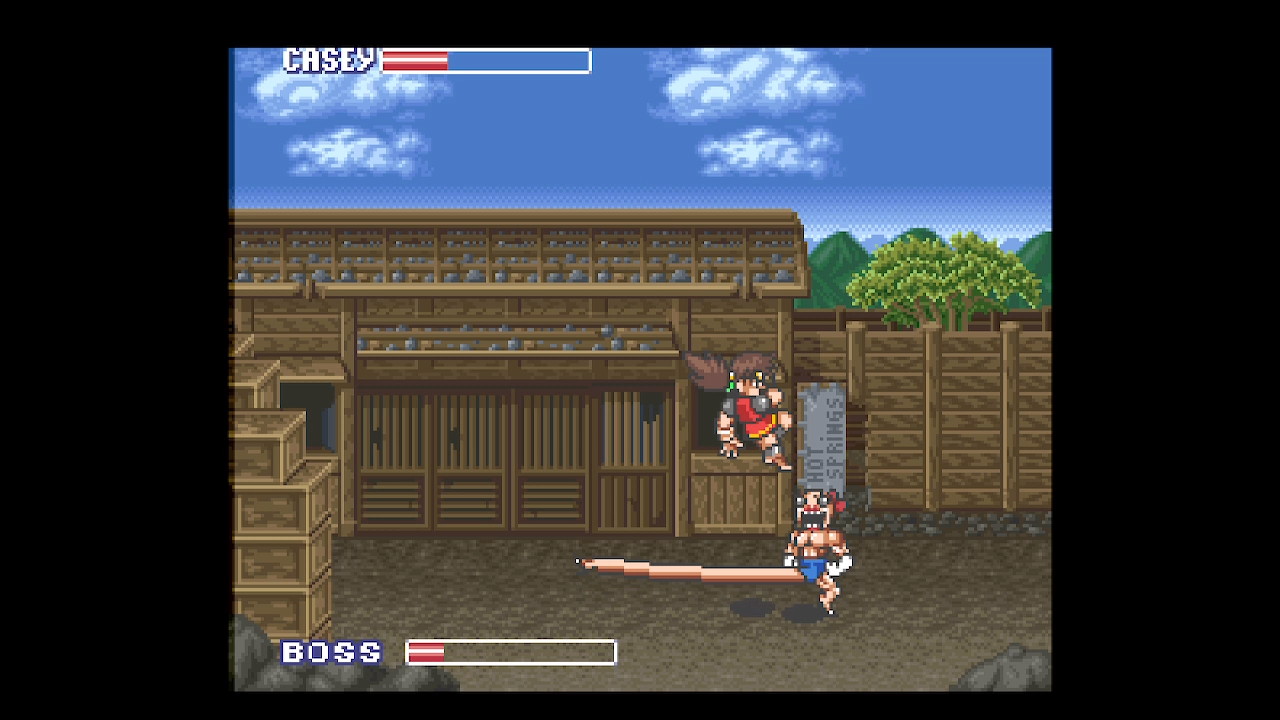 tela do jogo mostrando Casey enfrentando um monstro com uma perna esticada gigantesca 